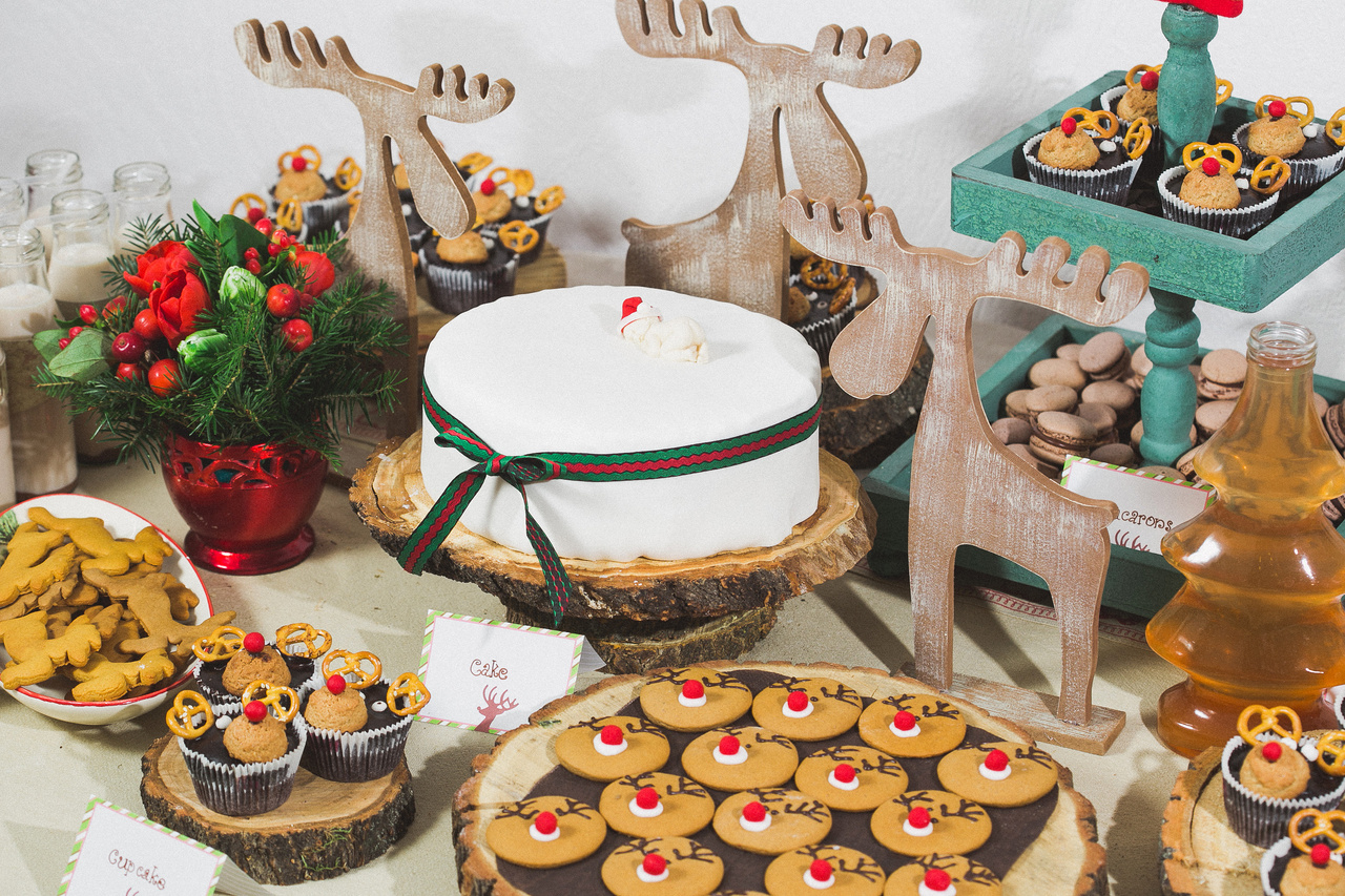 Cookie Exchange table ideas. Set up a buffet with a festive tablecloth, cupcake stands, and labels for each type of cookie.
